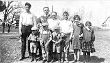 Mr. Herbert Striker, Teacher at Oak Shade School.  Bernard Dooley, "Squirt" Wittenwyler, Herman Baebler, Clark Dooley, Genevieve Dooley, Wilma Spring.  In front: ? McKenzie, Alvin Baebler, ?  McKenzie, circa 1922.